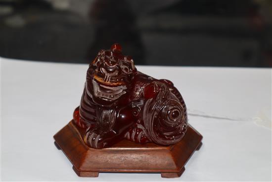 A Japanese ivory cane handle, a faux amber lion-dog and an enamel and ivory pill box